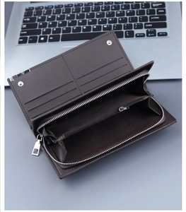 Macro shot of dark brown leather long wallet interior with card slots and zipper pocket