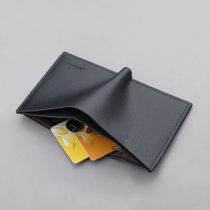 Vertical minimalist leather wallet for men with card slots and a zipper coin pocket
