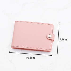 Pink faux leather slim card holder wallet with snap button closure and 10.8x7.7cm dimensions