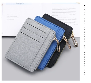 Macro shot of ultra-thin canvas card holders in grey, blue, and black with side zipper