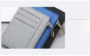 Slim canvas card holders in grey, blue and black with layered slots and gold zippers