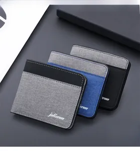 Vue détaillée de portefeuilles en toile durable gris bleus et noirs avec coutures fines