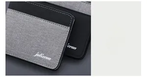 Détail de la texture en toile haute densité et coutures de précision du portefeuille