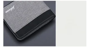 Détail du portefeuille en toile grise avec coutures contrastées et texture