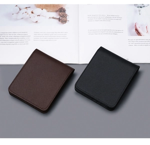 Close-up of slim bifold men's wallets in black and brown with Saffiano leather texture