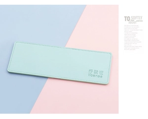 Detail of mint green lychee grain leather vehicle license holder with embossed text