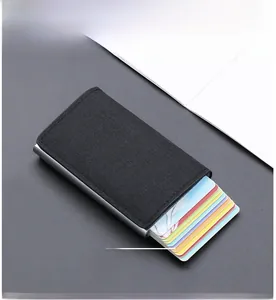 Detail view of the automatic pop-up mechanism for multiple cards in black nylon case