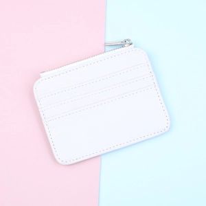 Close-up of white lychee pattern PU leather card holder with silver metal zipper and card slots