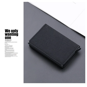 Detail of RFID-blocking canvas pop-up card holder with premium textured black fabric