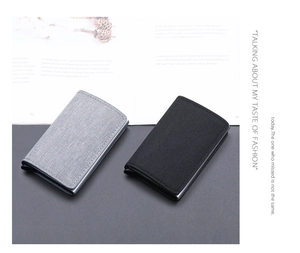 Detail of slim RFID canvas card holders in black and dark grey with metal frame