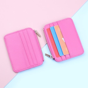 Pink lychee grain card holder with zipper closure and multiple card slots detail
