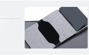 Macro view of detailed industrial stitching and inner black card slots on grey fabric wallet