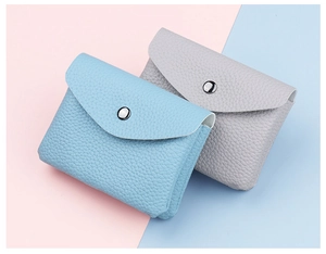 Detail of mini lychee texture faux leather coin purses with silver metal snap buttons