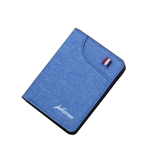 Slim denim blue canvas vertical wallet with a minimalist tricolor ribbon and logo