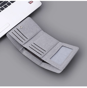 Detail of light gray canvas tri-fold wallet showing 6 card slots and ID window