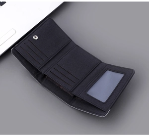 Inside detail of black canvas tri-fold wallet showing card slots and ID window