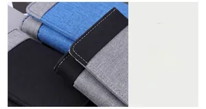 Detail shot of canvas tri-fold wallet showing contrast stitching and premium fabric texture