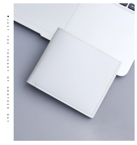 Close-up of a minimalist white leather wallet with neat stitching in an office setting