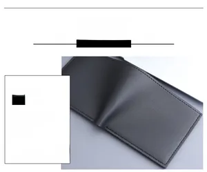 Detail view of charcoal gray bi-fold wallet featuring curved edge design and fine stitching