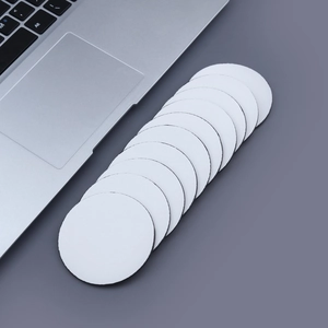 Macro view of white round non-slip heat coasters with textured surface and black rubber base