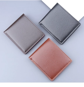Detailed view of men's bifold short wallets showing classic black and brown leather textures
