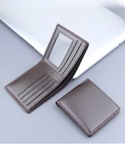Detailed view of brown lychee grain leather wallet with five card slots and ID window