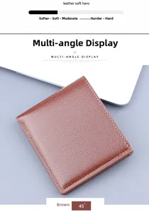 Close-up of brown men's bifold wallet showing soft pebble grain leather and stitching