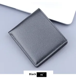Close-up of black lychee grain leather wallet with detailed stitching and bifold design