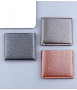 Detailed view of men's short leather wallets in black, dark brown, and reddish brown colors
