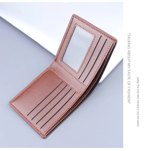 Interior detail of a brown bifold wallet showing the ID window and multiple card slots