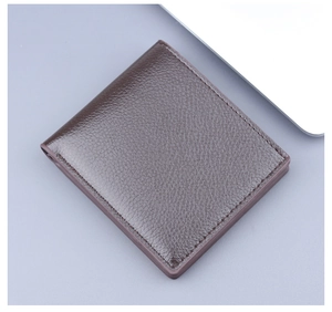Close-up of men's short bifold leather wallet with lychee grain texture in dark brown