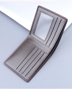 Detail view of a brown bifold men's wallet with six card slots and ID window
