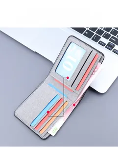 Detail view of the gray canvas wallet showing 7 card slots and dual cash compartments