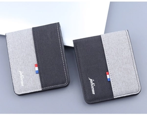 Close-up of canvas bi-fold wallets featuring gray stitching and tricolor ribbon detail