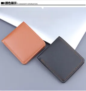 Dettaglio di portafogli bifold sottili in pelle marrone e nera con cuciture a contrasto