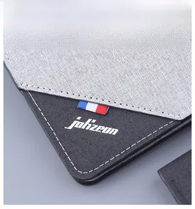 Detailed close-up of a grey canvas men's wallet with white stitching and brand logo