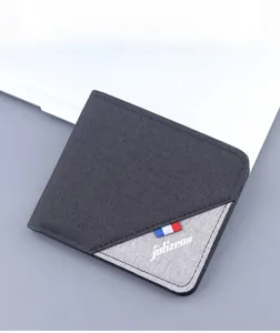 Detail view of bi-color canvas slim wallet for men featuring brand logo and flag detail