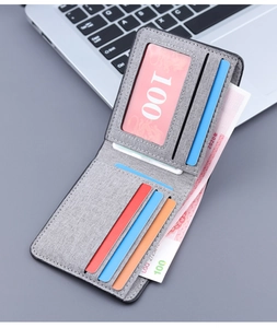Detail of slim grey canvas wallet interior showing card slots and bill compartment