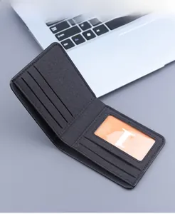 Detail view of canvas wallet interior featuring card slots and a clear ID window