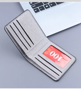 Interior layout of gray canvas bifold wallet with card slots and transparent ID window