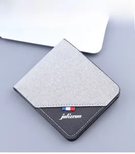 Detail view of grey canvas wallet showing multi-layered card slots and large capacity