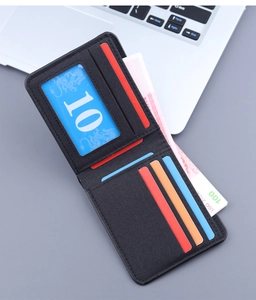 Detail of slim black canvas wallet interior showing card slots and transparent ID window