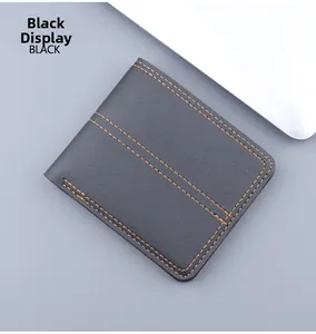 Close-up of black leather men's wallet with orange contrast stitching and litchi texture