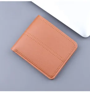 Detailed view of brown bifold wallet with pebble grain texture and double stitching