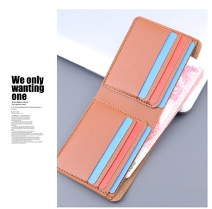Detail shot of a brown slim bifold wallet showing multiple card slots and cash pocket