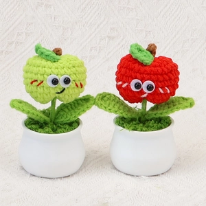 Handmade crochet apple desk plants with smiling faces in white ceramic pots