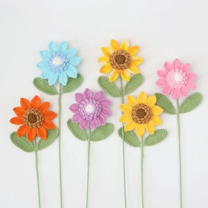 Detailed knit texture of multi-color handmade crochet sunflowers and daisies set