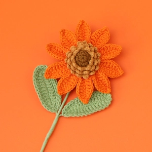 Detailed view of handmade crochet sunflower petals and textured brown yarn flower center