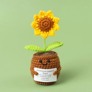 Detail of crocheted sunflower with smiling face pot and emotional support card