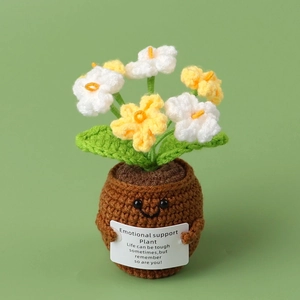 Macro detail of a handmade crochet Lily of the Valley plant with emotional support card